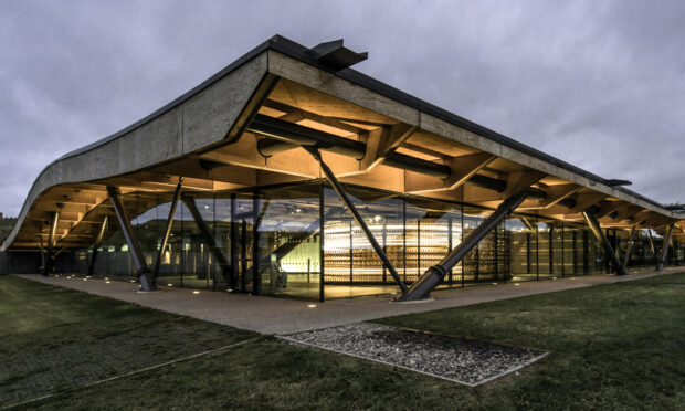 Macallan distillery exterior at dusk