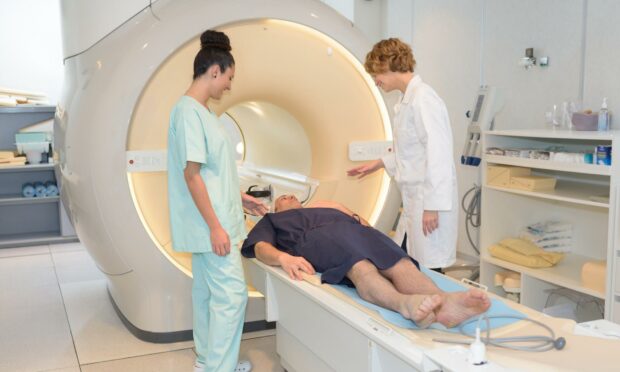 An MRI scanner allows patients to hear instructions in Doric.