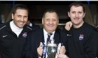 Jimmy Calderwood (centre) celebrates with son and assistant manager Scott (left) and coach Stuart Balmer after winning the Challenge Cup for Ross County in 2011. Image: SNS.