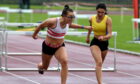 Jane Davidson, left, and Briagha Cook cross the line in the 100-metre hurdles at Aberdeen Sports Village. 
Picture by Kenny Elrick
