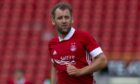 Former Aberdeen attacker Niall McGinn has signed for Peterhead.