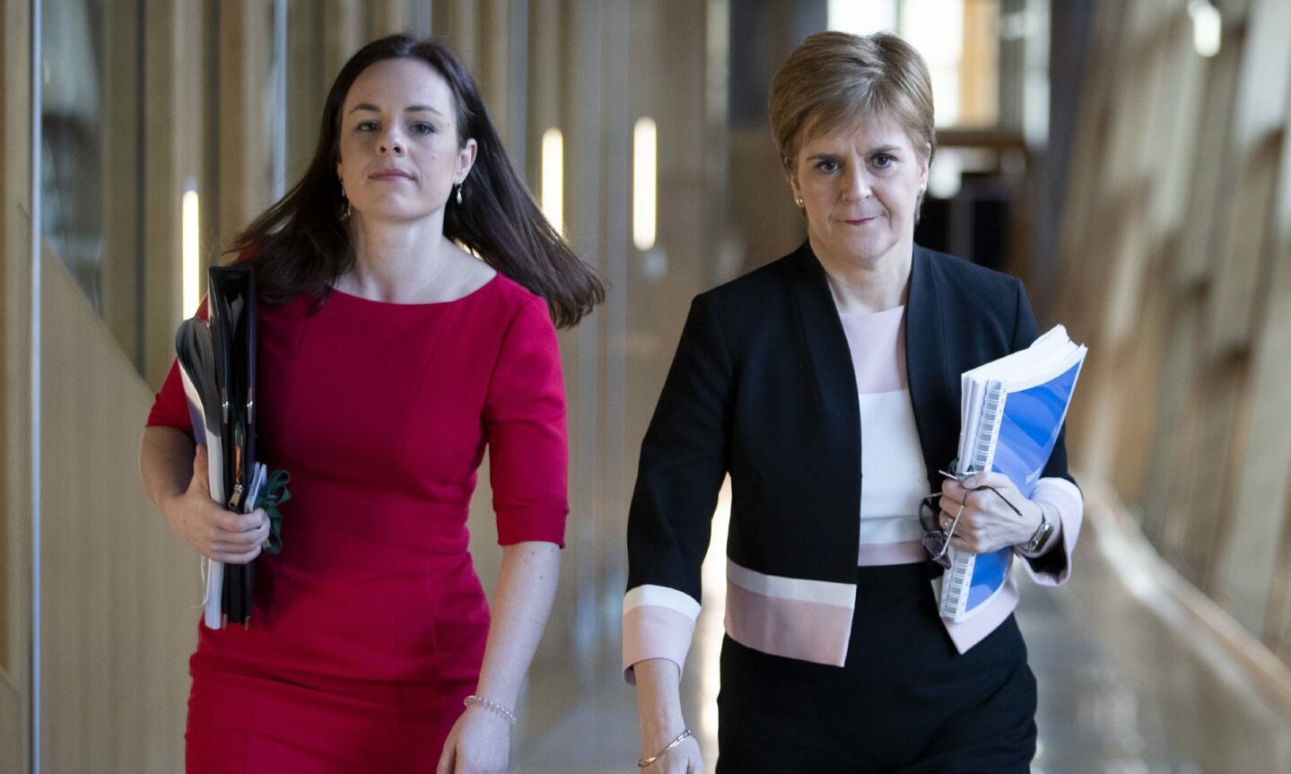 Finance secretary Kate Forbes walks through a Holyrood corridor with First Minister Nicola Sturgeon.