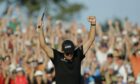 Phil Mickelson celebrates on the 18th green after winning the Masters in 2010.