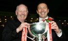 Former Aberdeen chairman Stewart Milne (left) and Derek McInnes celebrate with the League Cup trophy in 2014.