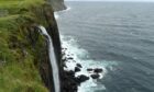 Tourists at the Kilt Rock geological feature on the east coast of Skye near Staffin. Image: Sandy McCook/ DC Thomson.