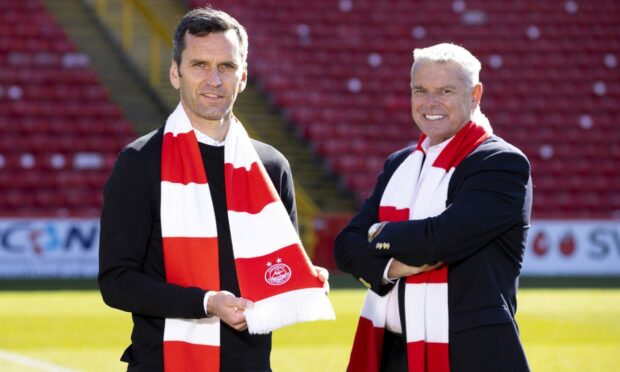 Dons chairman Dave Cormack, right, made a staunch defence of manager Stephen Glass.