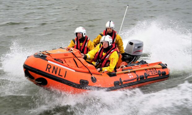 Aberdeen's inshore lifeboat was called to the scene after the body was spotted on the cliffs.