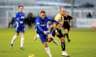 Cove's Sebastian Ross darts past Forfar's Gary Irvine.