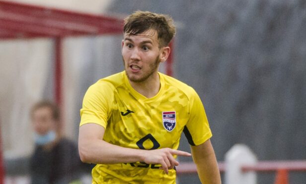 Jake Vokins in action for Ross County.