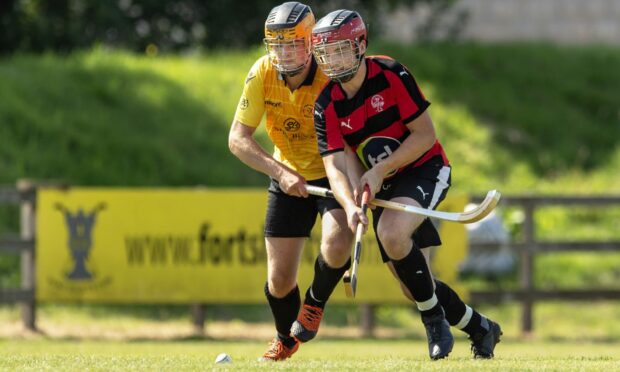 Oban's Daniel MacVicar, right, in action against Fort William.