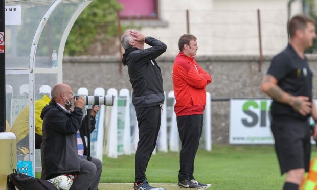 Nairn County manager Ronnie Sharp, hands on head, was disappointed to draw with Deveronvale.