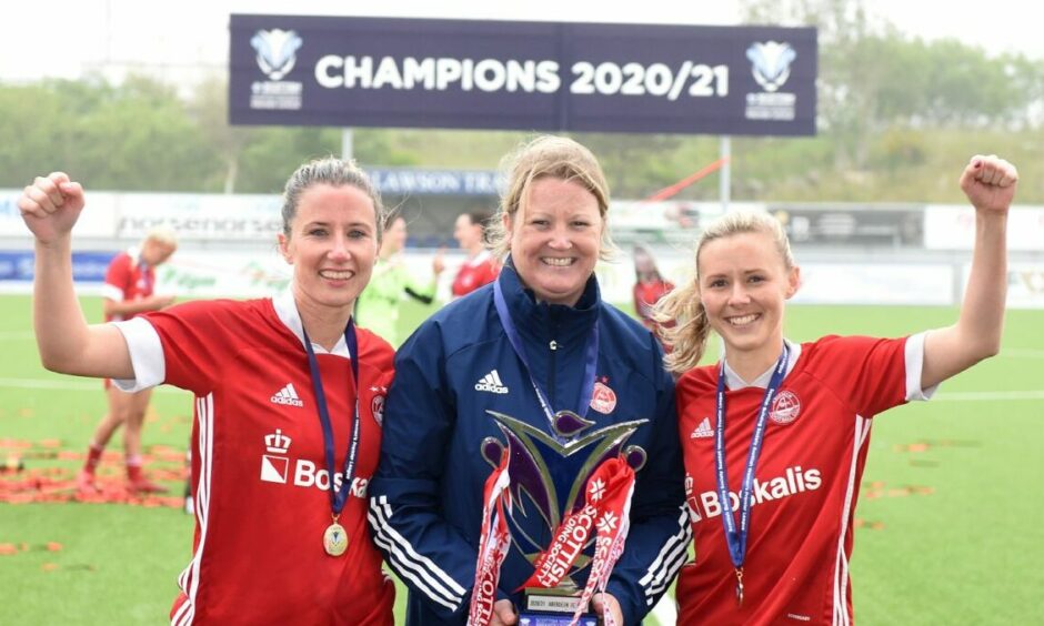 SWPL 2 title celebrations: Kelly Forrest with former Aberdeen Women manager Emma Hunter and Loren Campbell.