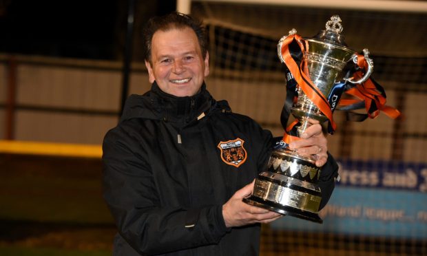 Ross Jack with the Highland League Cup trophy after Rothes' success in 2020.