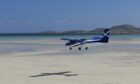 Aircraft landing on the beach at Barra Airport.