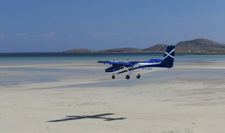 Aircraft landing on the beach at Barra Airport.