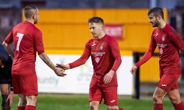 Andrew Macrae, centre, scored all three in Brora's win over Nairn County