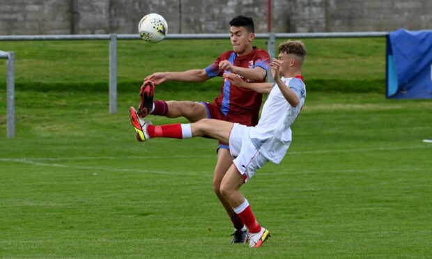 Rhys Thomas in action for Keith against Turriff United.
