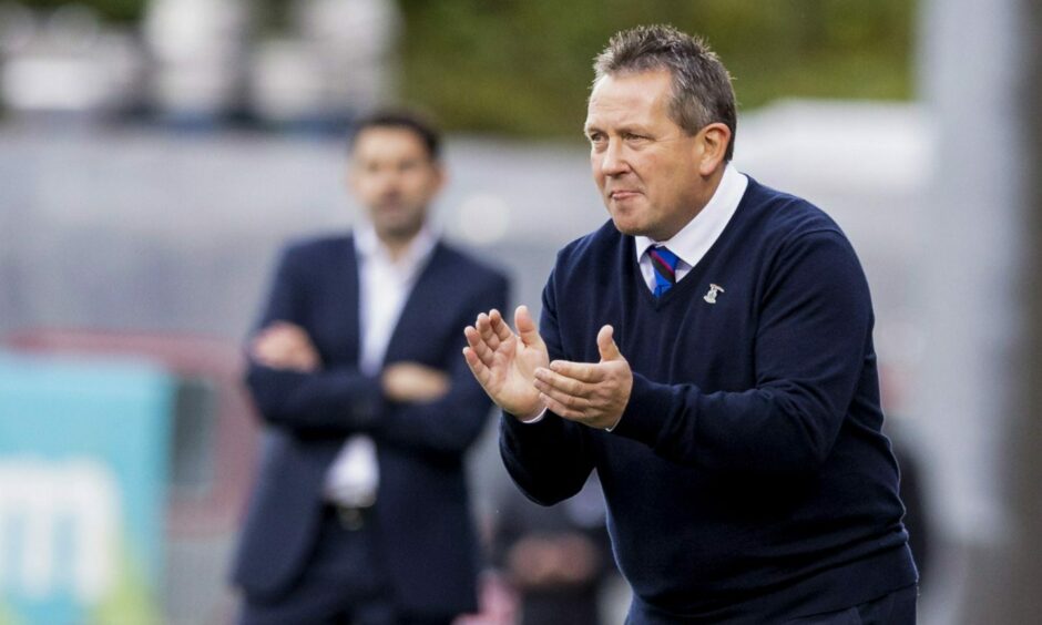 Caley Thistle head coach Billy Dodds claps from the sideline