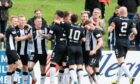 Elgin City players celebrate netting against Caley Thistle.