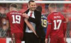 Aberdeen boss Stephen Glass celebrates after his side's victory against Hearts.