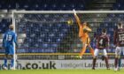 Inverness goalkeeper Mark Ridgers fails to deal with a wide free-kick from Arbroath's Michael McKenna which flies into the net for a 1-0 lead.