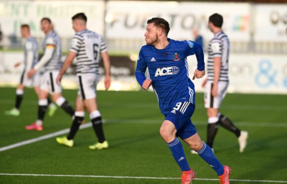 Mitch Megginson wheels away after levelling for Cove Rangers.