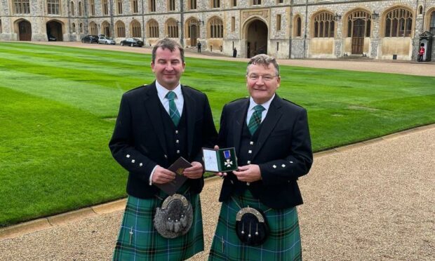 Professor Krukowski and his son Zygmunt at Windsor Castle with his LVO.