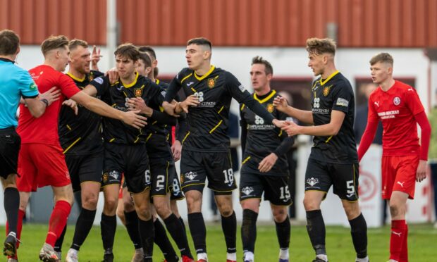 Tempers rise in the Scottish Cup tie between Brora Rangers and Albion Rovers.