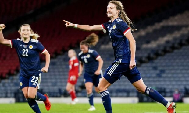 Christy Grimshaw, right, celebrates scoring for Scotland. Photo by Jane Barlow/PA Wire