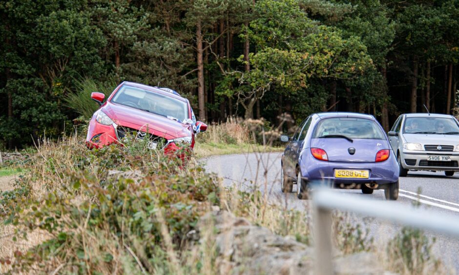 Car on the side of the road after a crash on the A93 at Crathes Castle in October 2021.