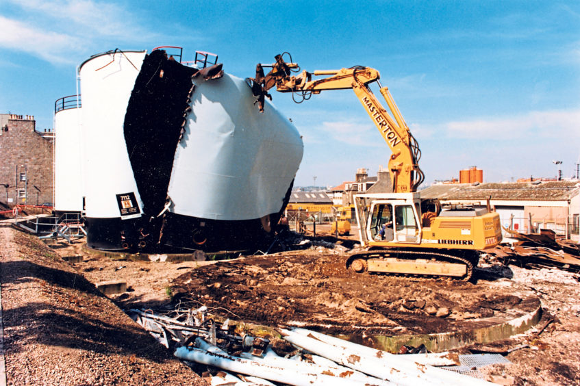 Ripping apart the storage tanks at the Esso petroleum base in Abbey Road