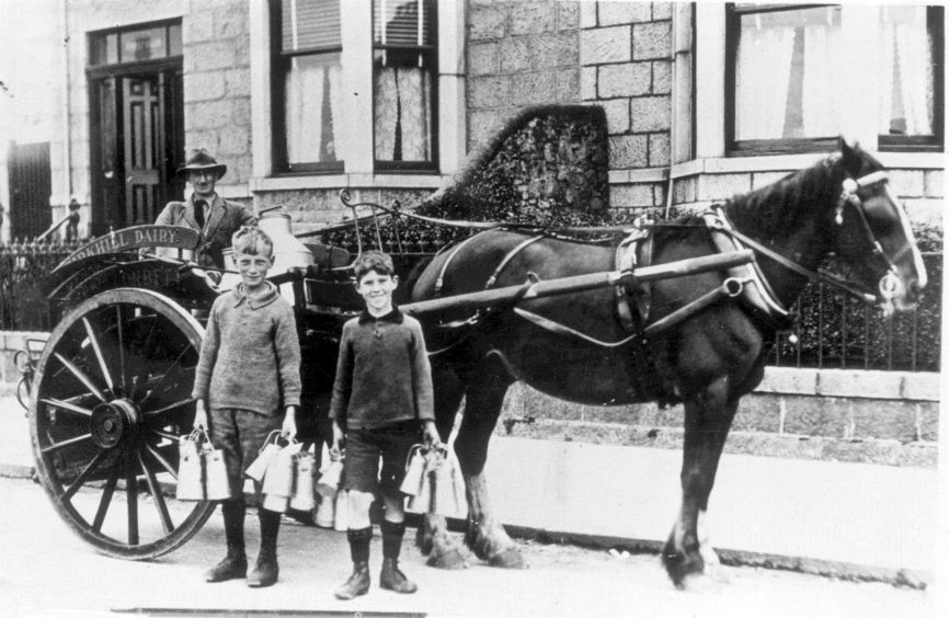 1930s: The milk boys, pictured here in the 30s, were a familiar sight on Torry streets.