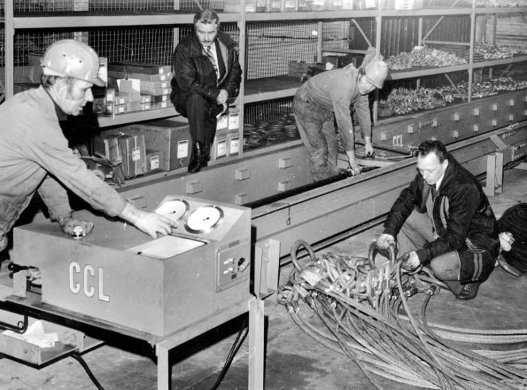 1976: Workers using a test bed at Aberdeen lifting tackle company Kennedy Lifting Ltd on Bedford Road.