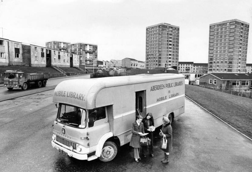 1976: D Morgan and Lily Gauld consult assistant Carolyn Ward at the mobile library on Girdleness Road in Aberdeen.