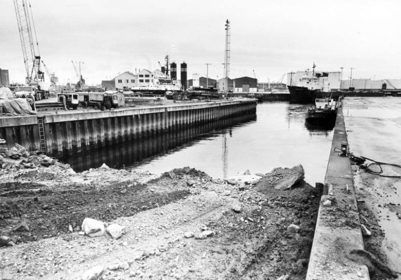 1985: Work was being done to fill in a dry dock and slipway at the Wood Group ship repair facility to cater for the need for more land at the Torry yard.