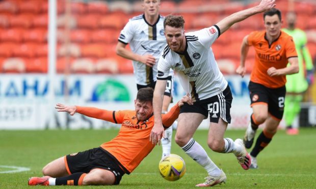 Aberdeen's Marley Watkins and Dundee United's Calum Butcher tangle.