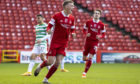 Lewis Ferguson celebrates scoring from the penalty spot to make it 3-3 against Celtic in October.