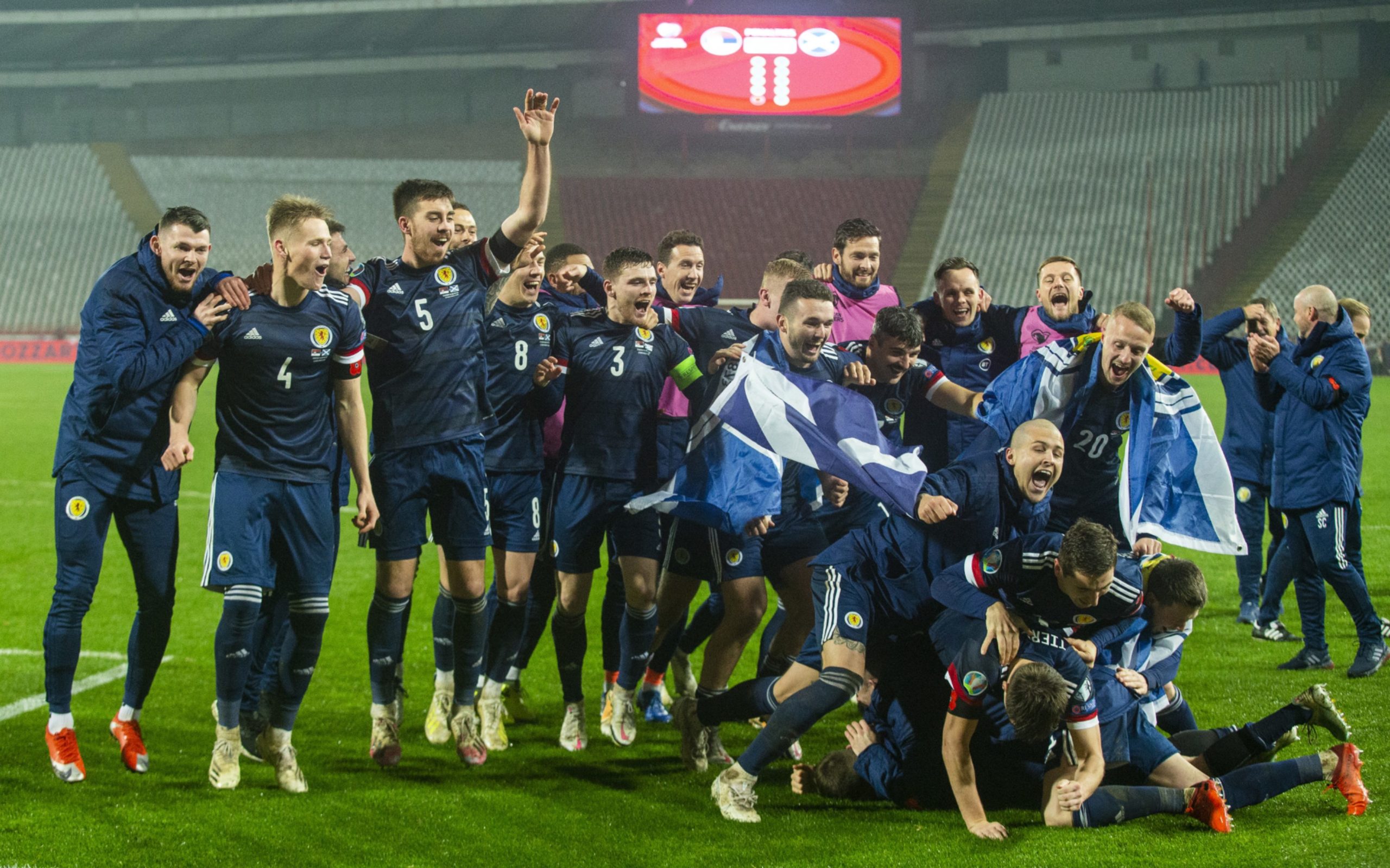 Scotland's players celebrate after David Marshall saves Aleksandar Mitrovic's penalty to send Scotland to the Euros.