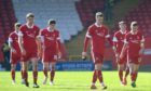 The Aberdeen players troop off after their Scottish Cup loss to Dundee United
