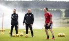 Aberdeen manager Stephen Glass, Gothenburg Great Neil Simpson and Scott Brown at training.