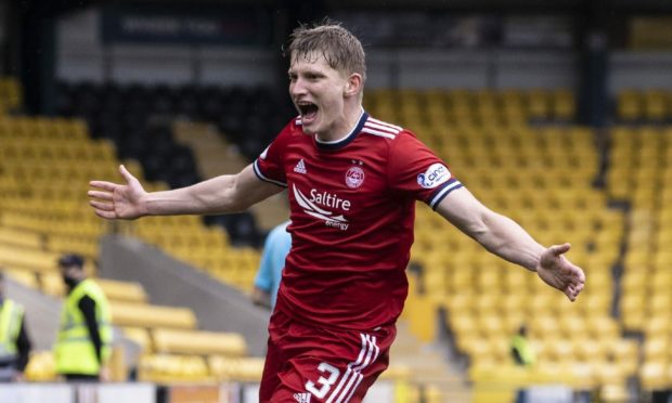 Aberdeen's Jack MacKenzie celebrates his late winner at Livingston.