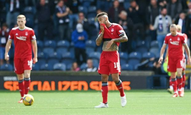 Aberdeen players look dejected after the full-time whistle at Raith Rovers.