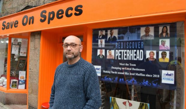 Keith Bennett outside his glasses shop, now called Spex Shop. He is offering business owners who vote down the renewal of the Peterhead Bid £100 store credit.