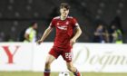 Calvin Ramsay in action for Aberdeen against Qarabag in the Europa Conference League play-offs.