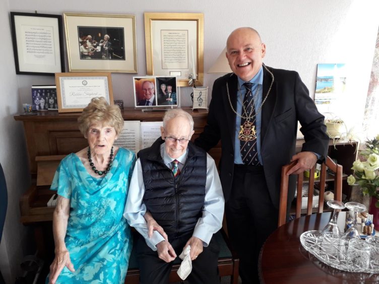 Esma and Robbie Shepherd on their 60th wedding anniversary with Barney Crockett.