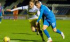 ICT's Aaron Doran (right) bursts past Morton's Michael Ledger last season. However, less fans backing away sides visited Inverness last season, with illegal TV streams cited as a problem.