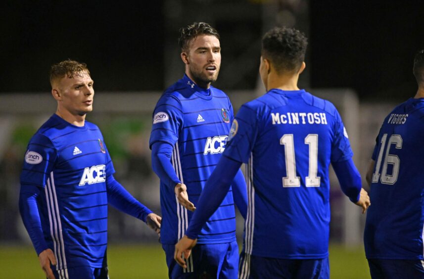 Leighton McIntosh is congratulated by Cove Rangers team-mates Fraser Fyvie and Morgyn Neill