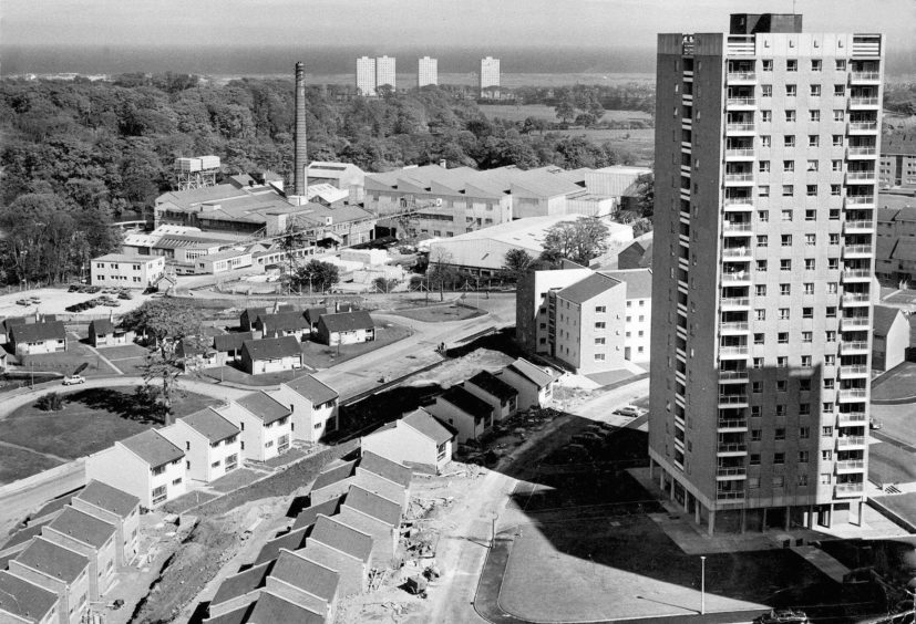 1971: A dramatic view of Donside Paper Mills, Aberdeen, with the new housing scheme at Hayton/Tillydrone going up in the foreground, with four skyscrapers at Seaton in the distance.