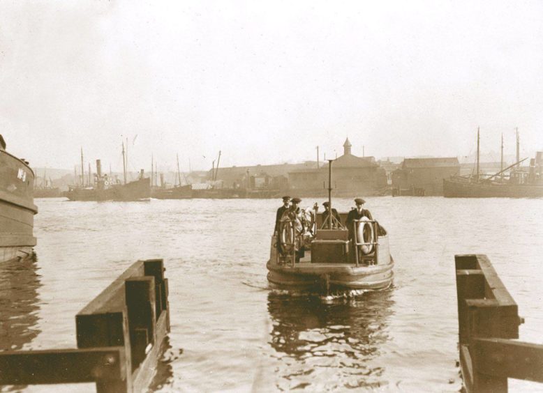 An Aberdeen Harbour ferry in operation around 1910 between Torry and the Footdee area.