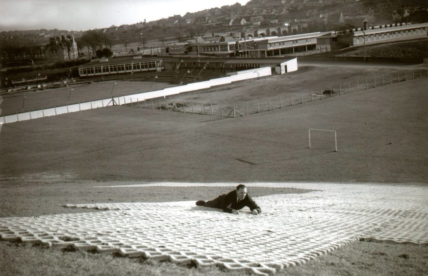 The new dry ski slope at Kaimhill was being laid in 1967, with the greyhound racing track and the Dee Motel in the background.